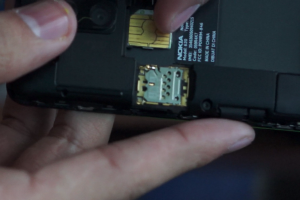 Video: How to Remove Back Cover and Insert Sim into Lumia